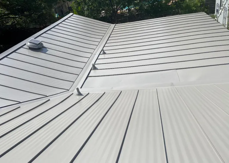 Solar attic fan installed on a metal roof for Roof Ventilation in Charleston
